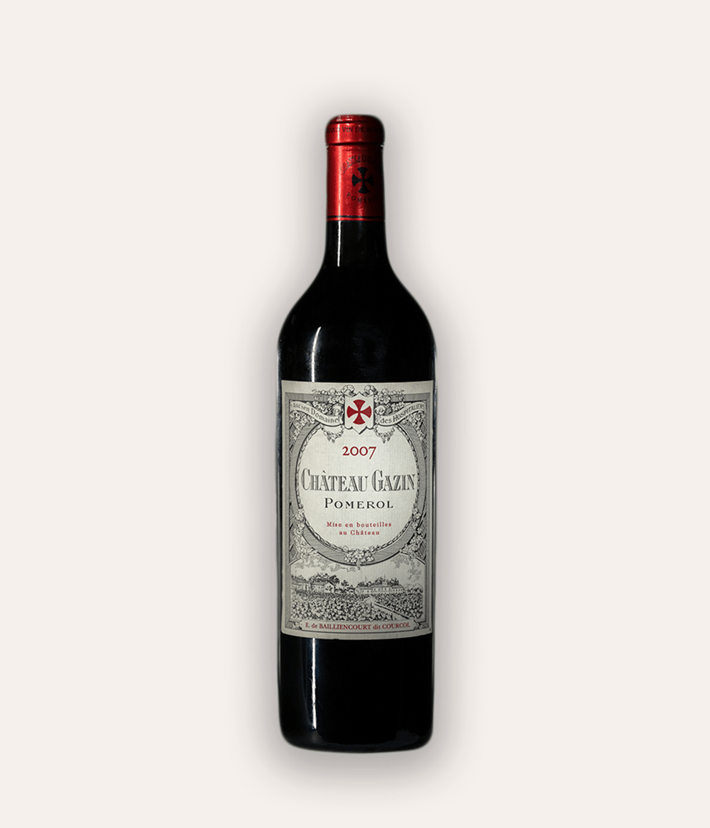 Weinflasche Château Gazin 2007 Pomerol – dunkle Bordeaux-Flasche mit roter Kapsel und Kreuz-Emblem, beiges Etikett mit ornamentaler Rahmung und Aufschrift Château Gazin Pomerol 2007